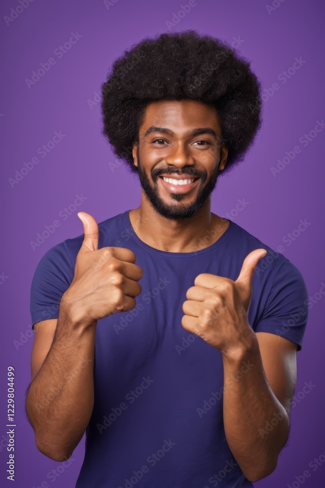 smiling man with afro hair giving thumbs up with both hands smiling man with afro hair giving thumbs up with both hands