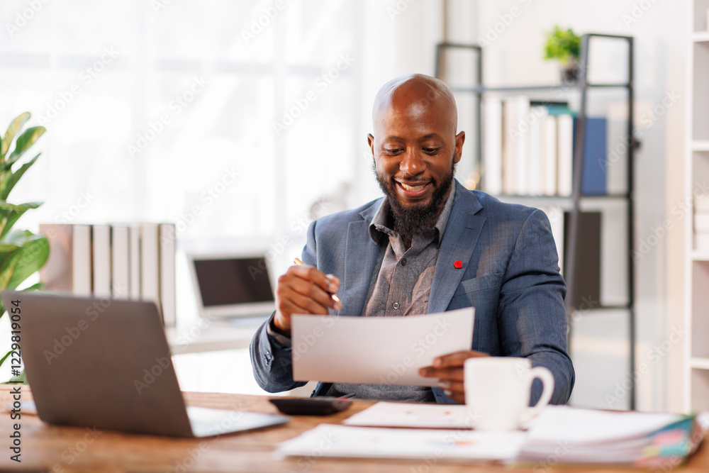 African American business man Accounting using calculating income-expenditure and analyzing real estate investment data report Financial and tax systems concept.
African American business man Accounting using calculating income-expenditure and analyzing real estate investment data report Financial and tax systems concept.