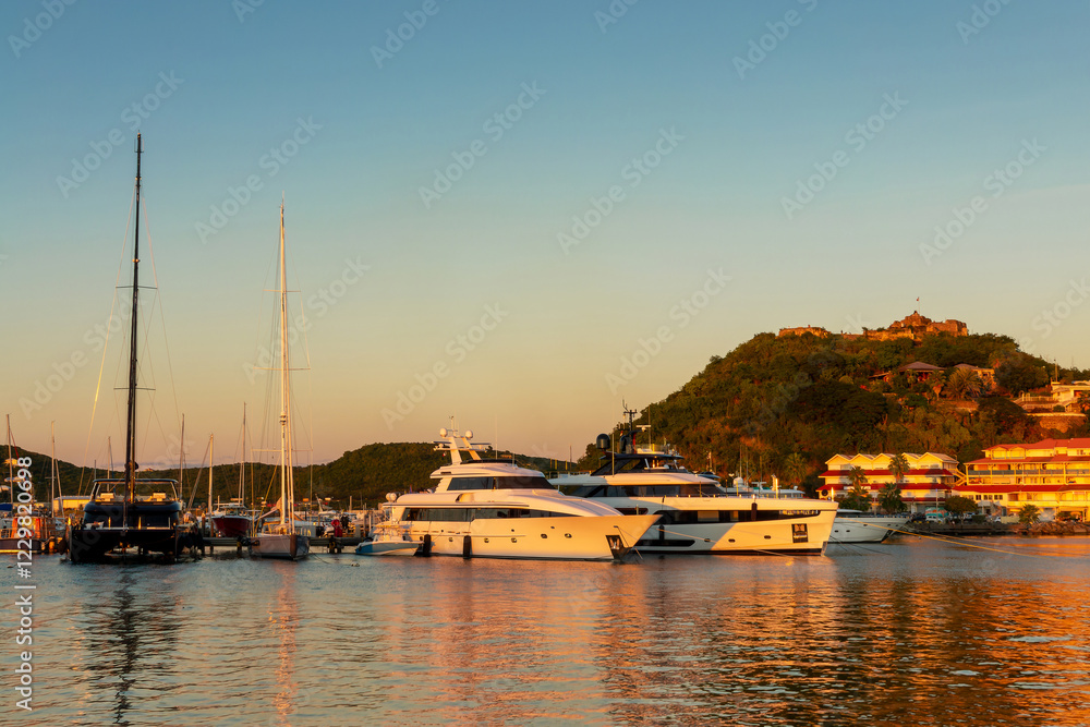 Fototapeta premium Luxury yachts in the harbor of Marigot in the Caribbean island of Saint Martin (Sint Maarten), French West Indies
