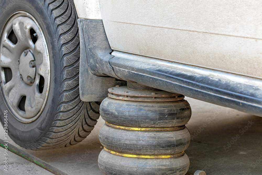 Crafting stability with innovative support while working under a vehicle at a workshop