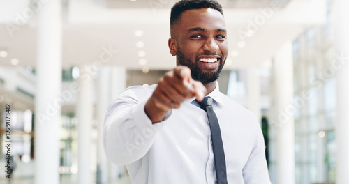 Pointing, portrait and smile of business black man in lobby of office for choice, opportunity or vote. Deal, recruitment and success with happy employee in workplace to select you as winner of bonus