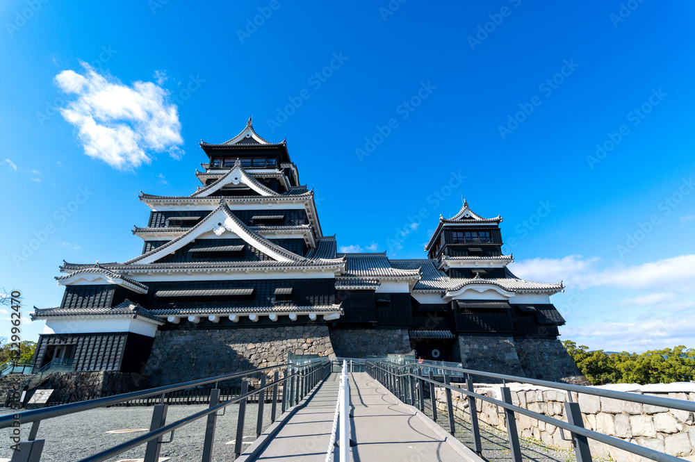 Tourist take photo Kumamoto Castle view from terrace and balcony in sunny blue sky day, Kumamoto, Japan.. the Kumamoto castle was a large and well-fortified castle.