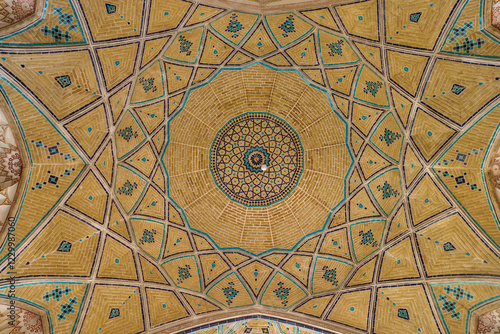 Ceiling patterns in the Agha Bozorg Mosque in Kashan, Iran. Ornaments are made in traditional Persian style. Mosque was built in the late 18th century