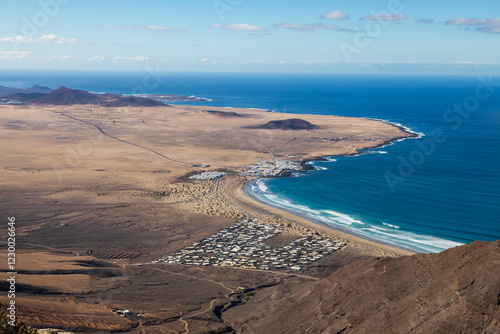 Surf Beach/An ariel view of a beautiful surfing beach called Playa De Famara shot on the Island of Lanzarote, Canary Islands, Spain.