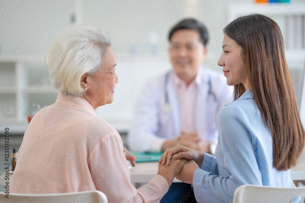 Obraz premium Adult Asian woman holds senior woman' s hand with kind and greetness while meets doctor at hospital, Older woman sees doctor with daughter.