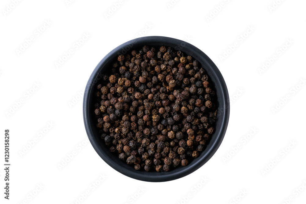 black pepper seeds in a black ceramic bowl isolated on white background, top view. black pepper seeds in a black ceramic bowl isolated on white background, top view.