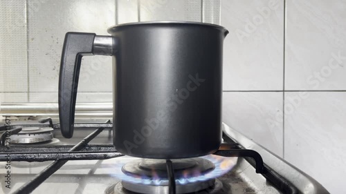 Tea making on gas stove. Water boiling on gas stove 
