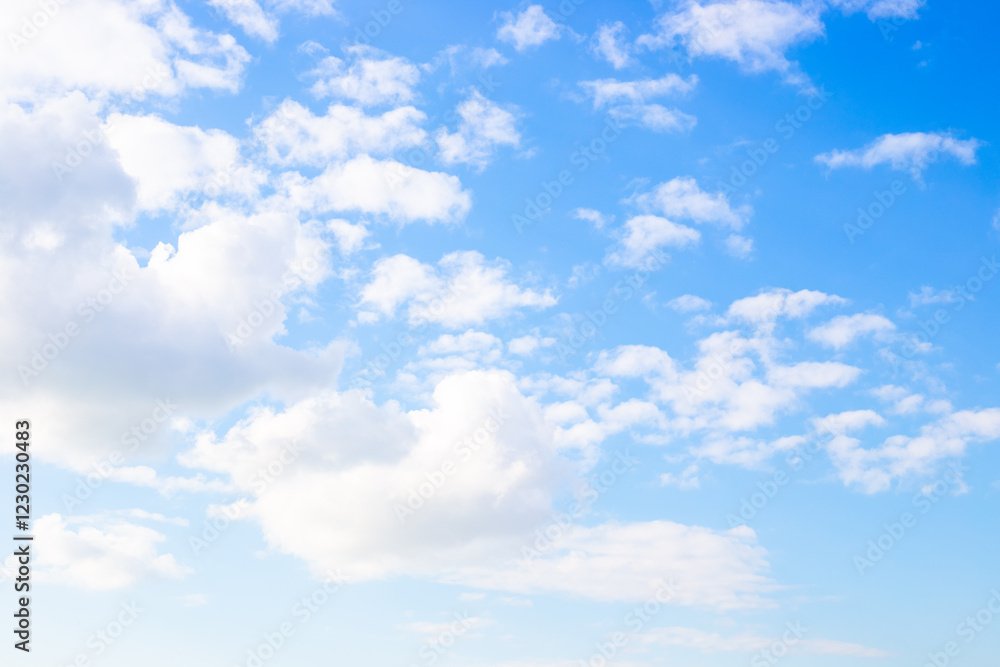 Light blue sky and white fluffy clouds. Celestial landscape, calm background Light blue sky and white fluffy clouds. Celestial landscape, calm background