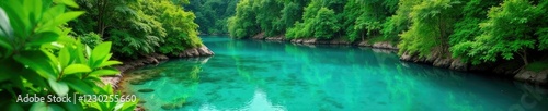 Lush green foliage surrounds a tranquil turquoise lagoon, water, serene