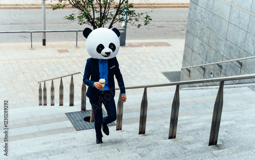 Storytelling image of a business man wearing a giant panda head photo