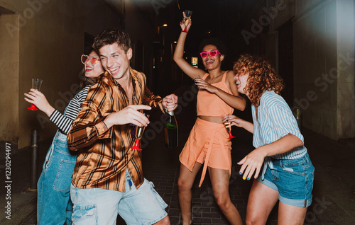 Friends going out in the evening and making party. Young people meeting outdoor in the weekend and celebrating together.