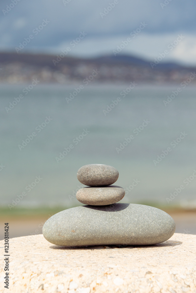 tranquil seashore scenic with rock cairn, calm water and shoreline tranquil seashore scenic with rock cairn, calm water and shoreline