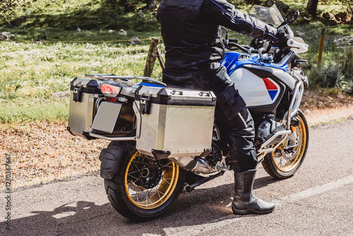 Closeup of travel saddlebags on a touring bike on a rural road