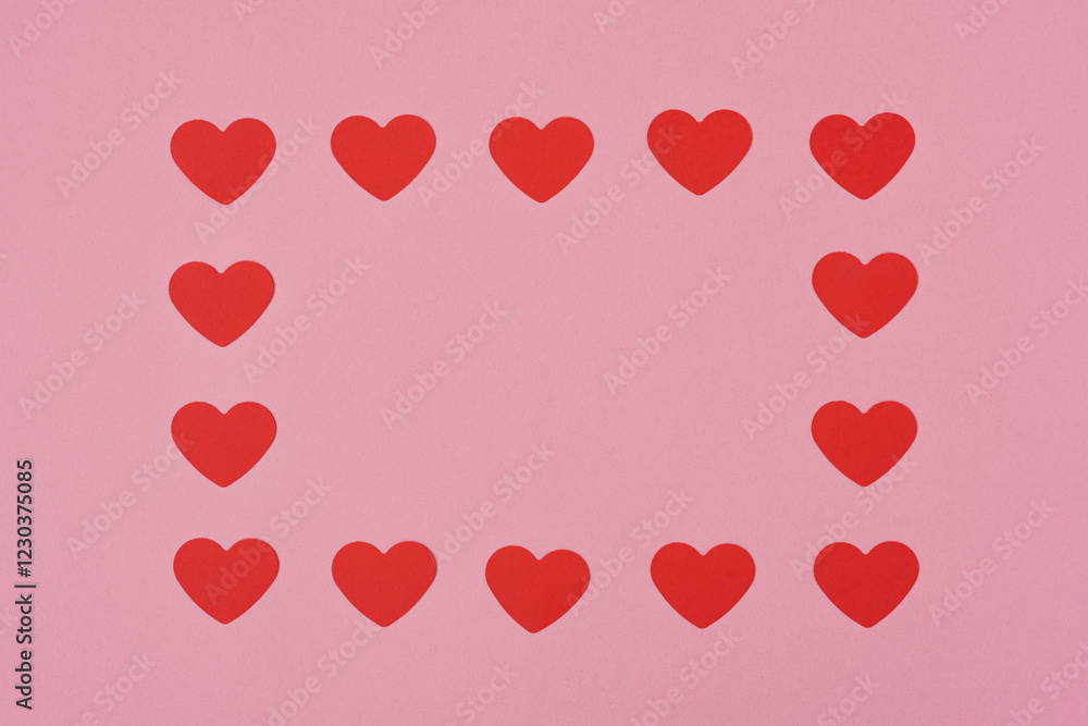 Red hearts pattern, paper cut romantic concept, top view. Beautiful hearts on pastel pink background with copy space. Valentines Day greeting card concept. Flat lay aesthetic.. Red hearts pattern, paper cut romantic concept, top view. Beautiful hearts on pastel pink background with copy space. Valentines Day greeting card concept. Flat lay aesthetic..
