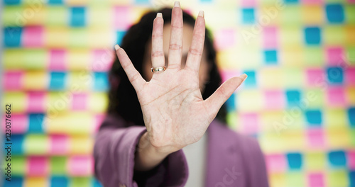 Cuadro en lienzo Woman, hand and stop with rejection on colorful background for no, refusal or objection in studio