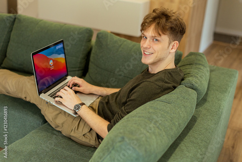 Young man enjoys working on...