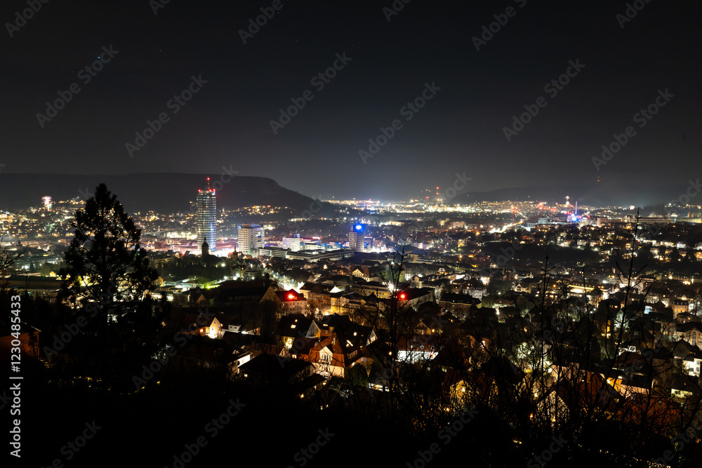 Obraz premium View of Jena in Thuringia from the Landgrafen viewpoint in the early hours of New Year's Eve 2025