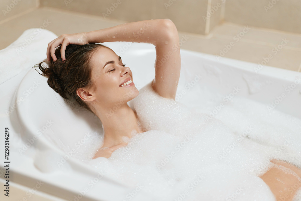 Relaxed woman enjoying a bubble bath, smiling with eyes closed, surrounded by foam and warmth. Self-care and wellness concept in a serene bathroom setting. Relaxed woman enjoying a bubble bath, smiling with eyes closed, surrounded by foam and warmth. Self-care and wellness concept in a serene bathroom setting.