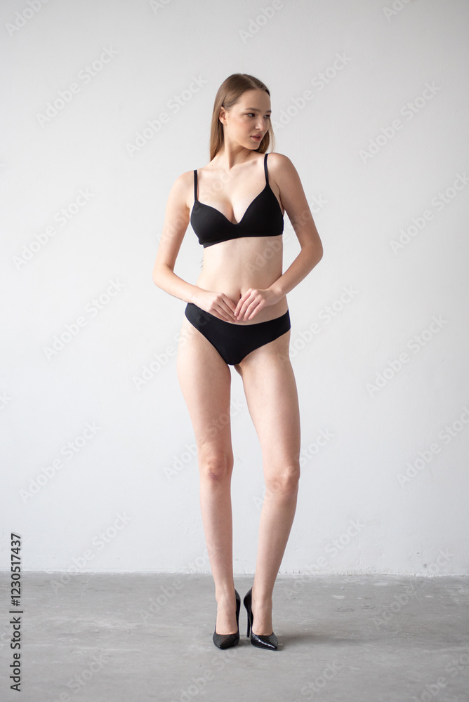 Casting snapshot of a fresh-faced model in simple black underwear, highlighting her natural features, body proportions, and confident stance. Ideal for agency scouting and professional portfolio updat Casting snapshot of a fresh-faced model in simple black underwear, highlighting her natural features, body proportions, and confident stance. Ideal for agency scouting and professional portfolio updat
