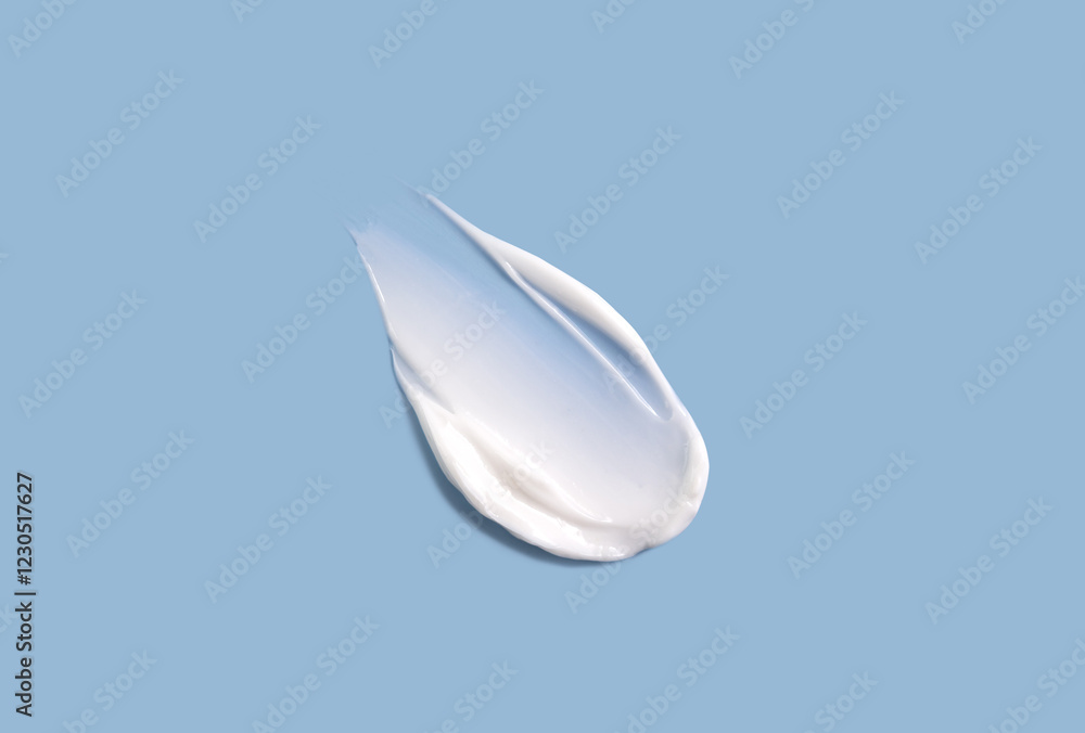 Cosmetic smear of cream texture on a blue background. Skin hydration. Cosmetic smear of cream texture on a blue background. Skin hydration.