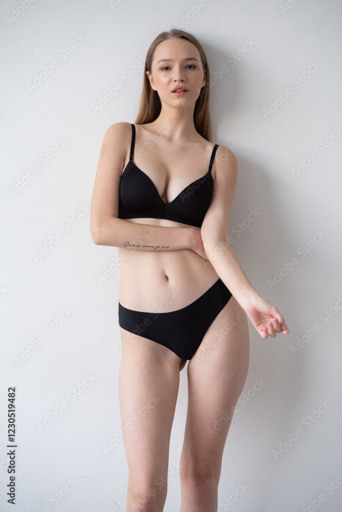 Casting snapshot of a fresh-faced model in simple black underwear, highlighting her natural features, body proportions, and confident stance. Ideal for agency scouting and professional portfolio updat Casting snapshot of a fresh-faced model in simple black underwear, highlighting her natural features, body proportions, and confident stance. Ideal for agency scouting and professional portfolio updat