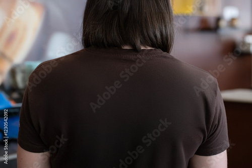 Woman's back with brown t-shirt photo