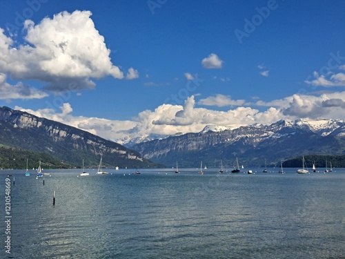 A lake in the Swiss Alps. The Blue Lake in Switzerland. Snow-capped mountains near the lake. Spring.