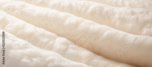 Close up of white synthetic filling creating a cozy and insulating layer in winter clothing