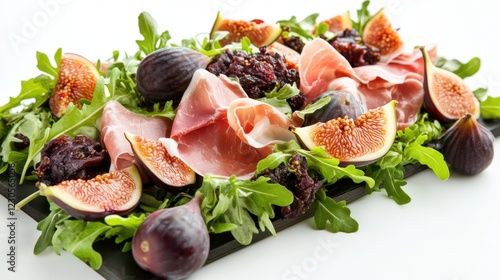 Abergavenny Food Festival Fresh arugula salad with prosciutto, figs, and jam on a serving plate photo