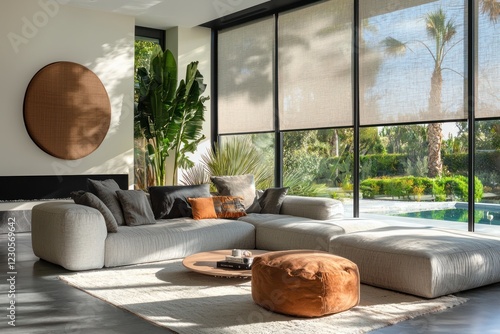 Motorized roller shades in a modern living room, featuring automated controls and summer-ready decor