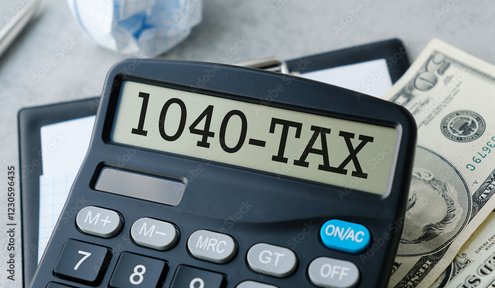 Word 1040-Tax on calculator. Business and tax concept on white background. Business Concept Word 1040-Tax on calculator. Business and tax concept on white background. Business Concept