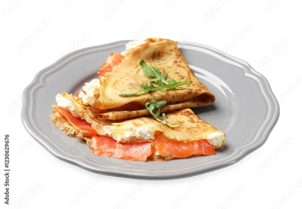 Delicious crepes with salmon, cream cheese and arugula isolated on white Delicious crepes with salmon, cream cheese and arugula isolated on white