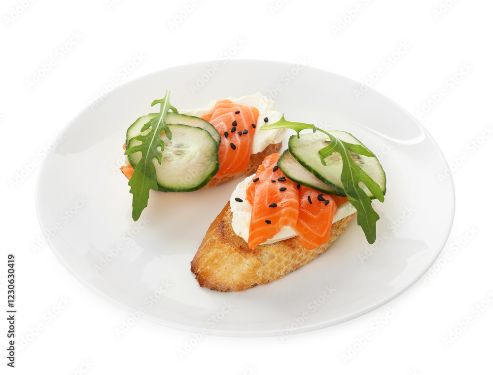 Delicious bruschette with cream cheese, salmon and cucumber isolated on white Delicious bruschette with cream cheese, salmon and cucumber isolated on white