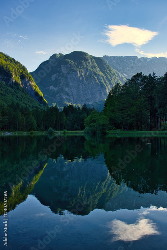 Mountain with reflection in a lake in Bluntautal Valley on a spring evening in Austria. photo