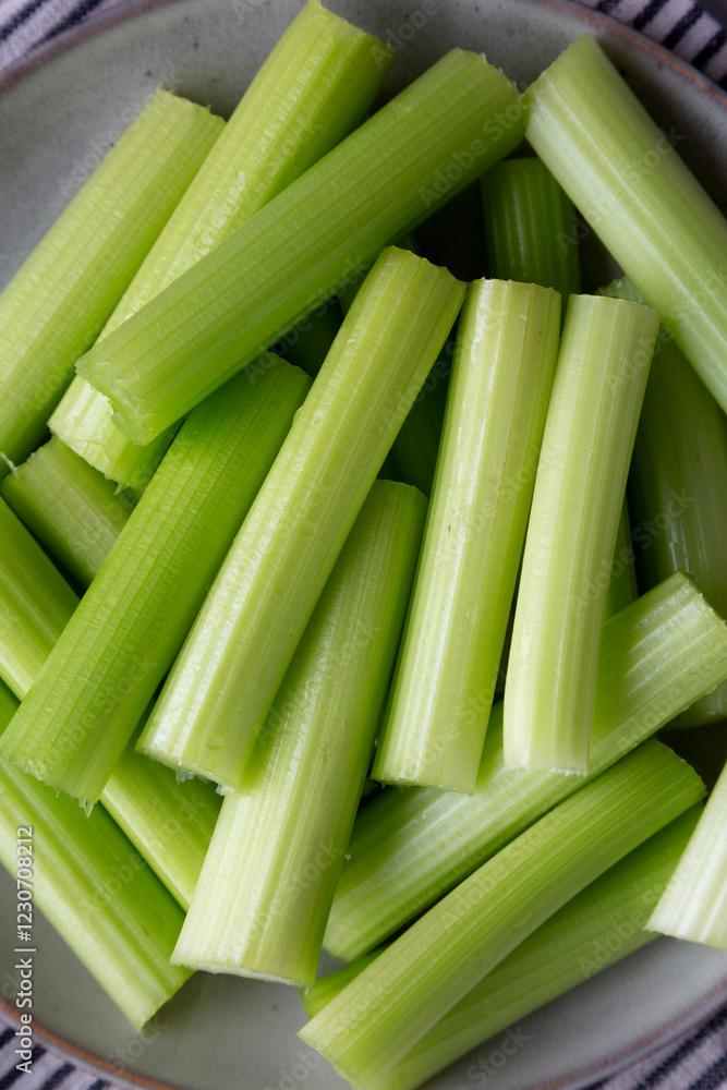 Raw Organic Celery Sticks on a Plate, top view. Raw Organic Celery Sticks on a Plate, top view.