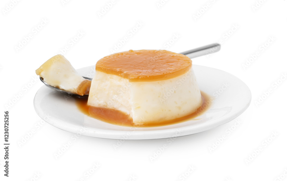 Tasty pudding with caramel sauce and spoon isolated on white Tasty pudding with caramel sauce and spoon isolated on white