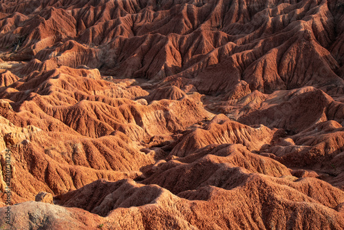 the Tatacoa Desert in Colombia, Huila, showcasing its arid landscape, eroded canyons, unique rock formations, and vibrant skies. Perfect for nature, travel, and adventure themes. photo