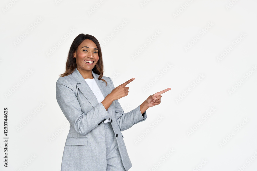 Happy African American professional business woman ceo executive wearing suit pointing fingers aside isolated on white. Smiling businesswoman manager looking at camera advertising business service. Happy African American professional business woman ceo executive wearing suit pointing fingers aside isolated on white. Smiling businesswoman manager looking at camera advertising business service.