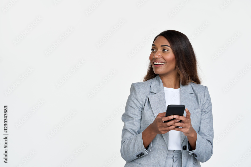 Happy African American professional business woman wearing suit holding cell phone using online banking app on smartphone looking away presenting mobile service standing isolated on white background. Happy African American professional business woman wearing suit holding cell phone using online banking app on smartphone looking away presenting mobile service standing isolated on white background.