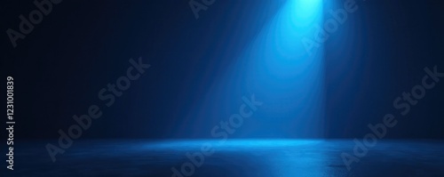 Shining beam of blue light illuminating a dark and empty space, spotlight, isolation, bleakness