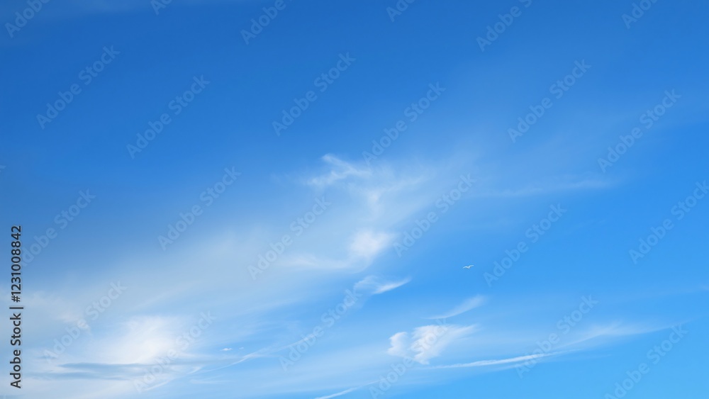 Serene Blue Sky with Wispy Clouds - Peaceful Nature Background Serene Blue Sky with Wispy Clouds - Peaceful Nature Background