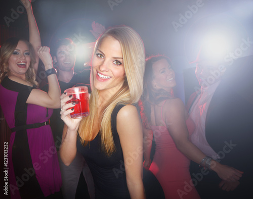 Photography Woman, club and night celebration with alcohol, dancefloor and dancing confidence with music at venue