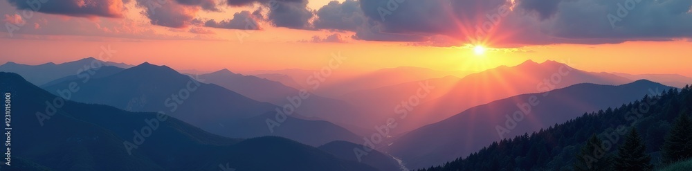 Luminous wisps of cloud illuminate the valleys below at golden hour, glowing, inviting, mountains Luminous wisps of cloud illuminate the valleys below at golden hour, glowing, inviting, mountains