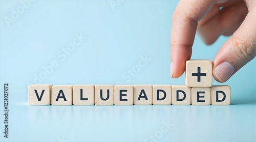 Value add concept. Value add for business. Hand place wooden cube with plus sign on light blue background. download style which means value added. Positive thinking or personal growth and development.