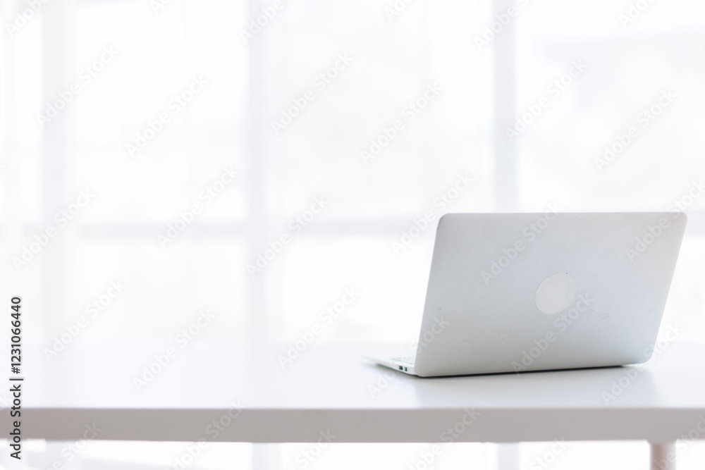 custom made wallpaper toronto digitalLaptop Computer, notebook, office space ,and eyeglasses sitting on a desk in a large open plan office space after working hours
