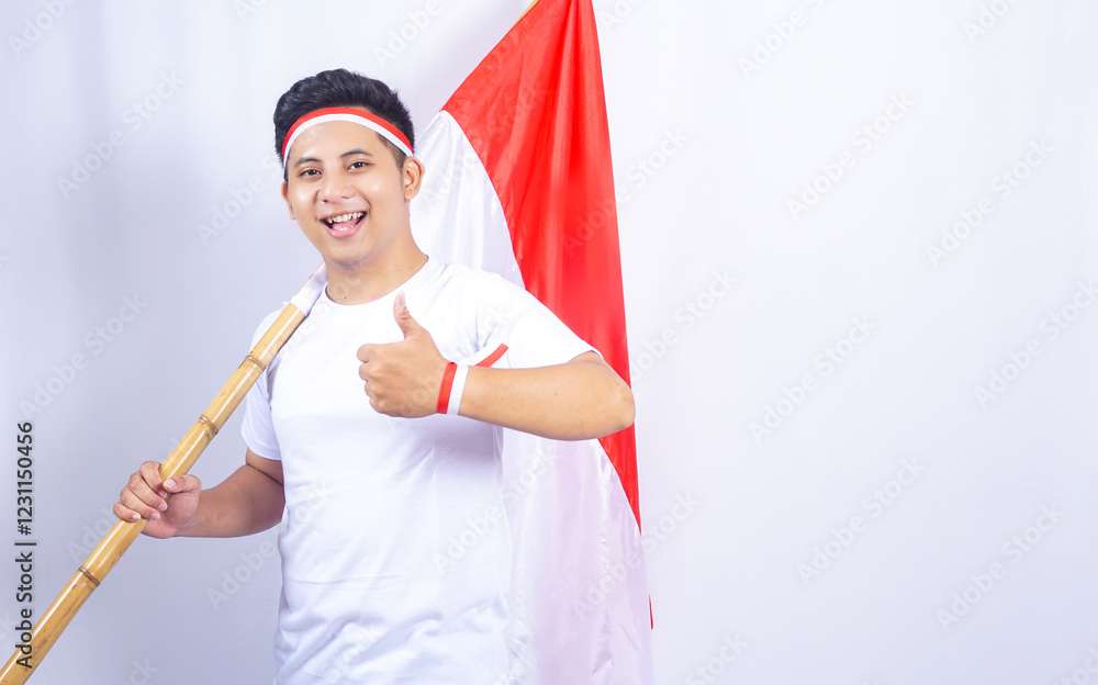 Handsome Indonesian Young Man Showing Thumbs up while Holding Country Flag Handsome Indonesian Young Man Showing Thumbs up while Holding Country Flag