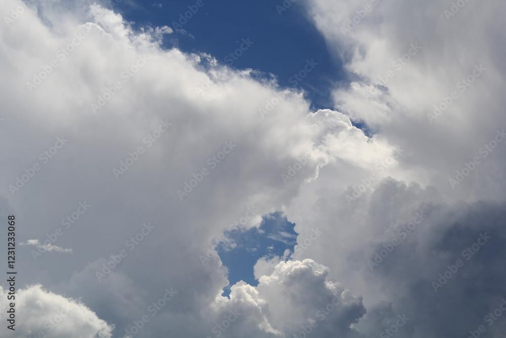 Fototapeta premium Close-up of cumulus fluffy white clouds in a blue sky