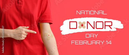 Female blood donor pointing at applied patch on red background, closeup photo