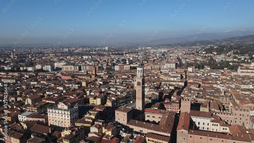 explore a stunning aerial rotating view of Piazza delle Erbe and tis Torre dei Lamberti, showcasing the vibrant city life and historical architecture, all under the bright daylight. explore a stunning aerial rotating view of Piazza delle Erbe and tis Torre dei Lamberti, showcasing the vibrant city life and historical architecture, all under the bright daylight.