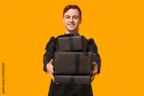 Young man with gift boxes o...